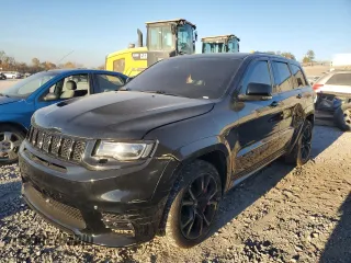 2017 Jeep Grand Cherokee SRT with VIN 1C4RJFDJ6HC828848, listed as a Copart auction lot 75535903 with 106,870 mi miles and Salvage Title. Bid and sale history available at carsss.com. Image 1.