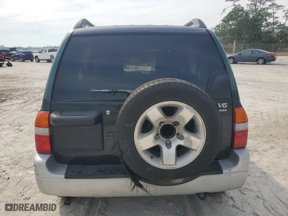2000 Suzuki Grand Vitara JLX with VIN JS3TD62V5Y4113946, listed as a Copart auction lot 49154945 with 0 mi miles and Non Repairable. Bid and sale history available at carsss.com. Image 6.