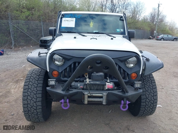 2012 Jeep Wrangler Unlimited Sahara with VIN 1C4BJWEG9CL220965, listed as a IAAI auction lot 41902295 with 120,492 mi miles. Bid and sale history available at carsss.com. Image 13.