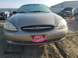 2003 Ford Taurus z VIN 1FAFP52253A170456, wystawiony jako Copart lot #70009824 z przebiegiem 216 567 mil mil oraz Szkoda całkowita • Salvage title. Historia ofert i sprzedaży dostępna na DreamBid. Obrazek 5.