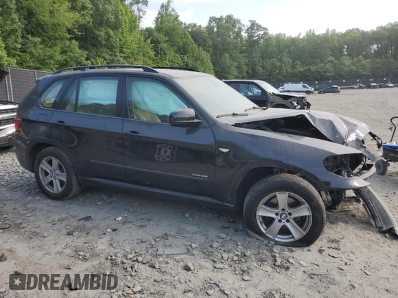 2012 BMW X5 35i with VIN 5UXZV4C5XCL761370, listed as a Copart auction lot 59436845 with 124,722 mi miles and Salvage title. Bid and sale history available at DreamBid. Image 4.