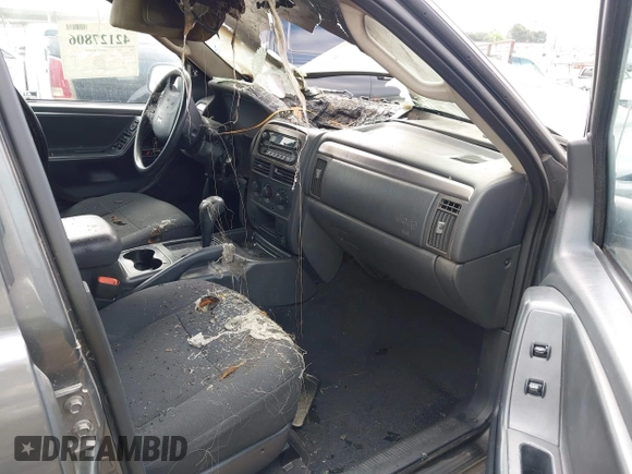 2004 Jeep Grand Cherokee Laredo z VIN 1J4GX48S24C161519, wystawiony jako IAAI lot #42127806 z przebiegiem Nie podano mil oraz . Historia ofert i sprzedaży dostępna na DreamBid. Obrazek 5.
