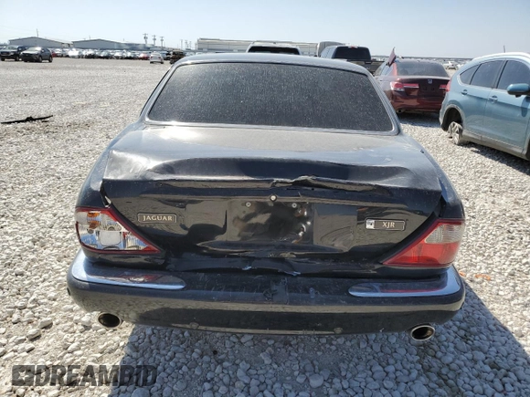 2002 Jaguar XJ with VIN SAJDA15BX2MF47193, listed as a Copart auction lot 49065275 with 69,544 mi miles and Salvage title. Bid and sale history available at DreamBid. Image 6.