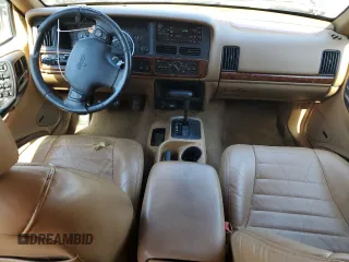 1998 Jeep Grand Cherokee with VIN 1J4FX48S8WC281615, listed as a Copart auction lot 77305594 with 128,393 mi miles and Salvage title. Bid and sale history available at DreamBid. Image 8.