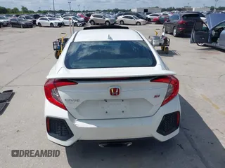 2018 Honda Civic Si with VIN 2HGFC1E53JH700251, listed as a IAAI auction lot 42043732 with 104,763 mi miles and . Bid and sale history available at DreamBid. Image 16.