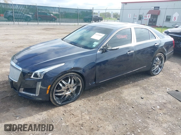 2015 Cadillac CTS Luxury AWD with VIN 1G6AX5SX5F0119102, listed as a IAAI auction lot 42231015 with 106,643 mi miles and . Bid and sale history available at DreamBid. Image 2.