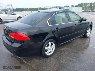 2010 Kia Optima LX with VIN KNAGG4A85A5375227, listed as a IAAI auction lot 42019118 with 221,324 mi miles. Bid and sale history available at carsss.com. Image 4.
