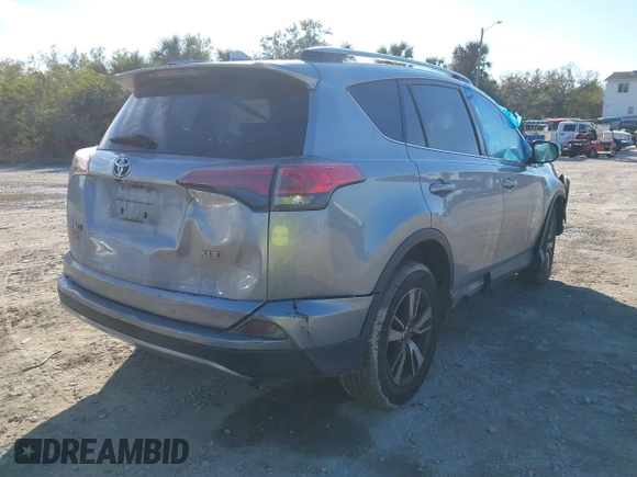 2018 Toyota RAV4 XLE with VIN JTMWFREV7JD125119, listed as a IAAI auction lot 41841021 with 132,659 mi miles and . Bid and sale history available at DreamBid. Image 4.