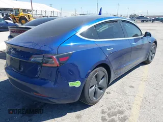 2020 Tesla Model 3 Standard Range Plus with VIN 5YJ3E1EA1LF590396, listed as a IAAI auction lot 41868089 with 51,278 mi miles. Bid and sale history available at carsss.com. Image 4.