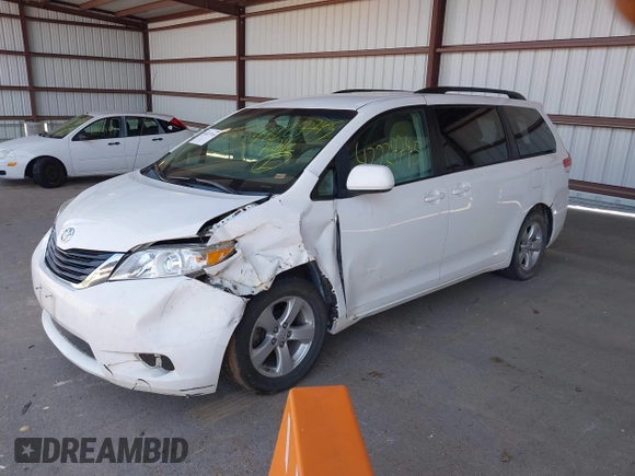 2014 Toyota Sienna LE AAS with VIN 5TDKK3DC2ES434546, listed as a IAAI auction lot 42227745 with 175,445 mi miles and . Bid and sale history available at DreamBid. Image 2.