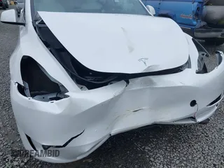 2023 Tesla Model Y Long Range z VIN 7SAYGAEEXPF647352, wystawiony jako IAAI lot #41955933 z przebiegiem Nie podano mil oraz . Historia ofert i sprzedaży dostępna na DreamBid. Obrazek 6.