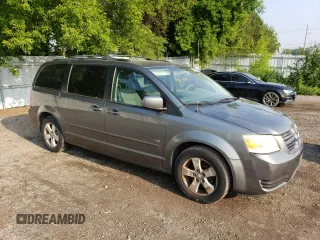 2009 Dodge Grand Caravan SE with VIN 2D8HN44E29R694728, listed as a Copart auction lot 60287565 with 233,018 mi miles and Clean title. Bid and sale history available at DreamBid. Image 4.