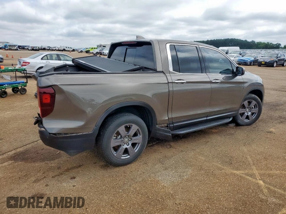 2020 Honda Ridgeline RTL-E with VIN 5FPYK3F79LB001891, listed as a Copart auction lot 58569255 with 34,513 mi miles and Salvage title. Bid and sale history available at DreamBid. Image 3.
