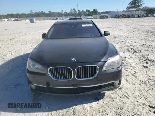 2011 BMW 7 Series with VIN WBAKX8C55BC198177, listed as a Copart auction lot 77016924 with 99,275 mi miles and Salvage title. Bid and sale history available at DreamBid. Image 5.