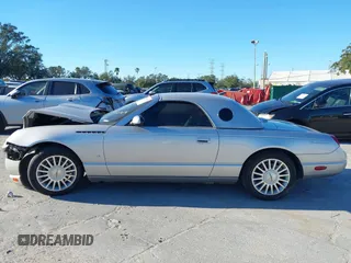 2004 Ford Thunderbird Deluxe with VIN 1FAHP60A84Y100984, listed as a IAAI auction lot 40978553 with 113,051 mi miles. Bid and sale history available at carsss.com. Image 14.