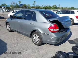 2009 Nissan Versa 1.8 S with VIN 3N1BC11E09L377706, listed as a IAAI auction lot 42027981 with 146,105 mi miles. Bid and sale history available at carsss.com. Image 3.