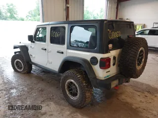 2022 Jeep Wrangler Unlimited Rubicon with VIN 1C4JJXFM0NW154202, listed as a IAAI auction lot 42400067 with 60,486 mi miles and . Bid and sale history available at DreamBid. Image 3.