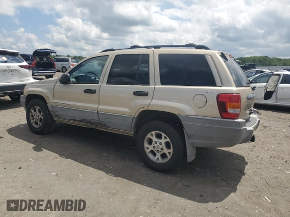 1999 Jeep Grand Cherokee Laredo with VIN 1J4GW58N7XC799434, listed as a Copart auction lot 64790905 with 272,384 mi miles and Salvage title. Bid and sale history available at DreamBid. Image 2.