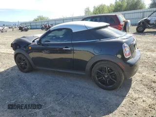 2015 MINI Cooper Coupe with VIN WMWSX1C52FT508184, listed as a Copart auction lot 60639664 with 95,502 mi miles and Salvage Title. Bid and sale history available at carsss.com. Image 2.