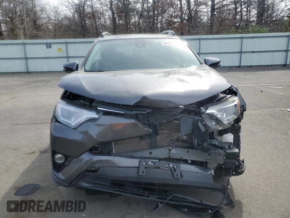 2018 Toyota RAV4 XLE with VIN JTMRFREV5JJ739973, listed as a Copart auction lot 54490225 with 65,807 mi miles and Salvage Title. Bid and sale history available at DreamBid. Image 5.