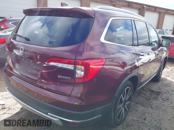 2020 Honda Pilot Touring 8-Passenger with VIN 5FNYF5H94LB012062, listed as a IAAI auction lot 40806740 with 115,431 mi miles and . Bid and sale history available at DreamBid. Image 4.