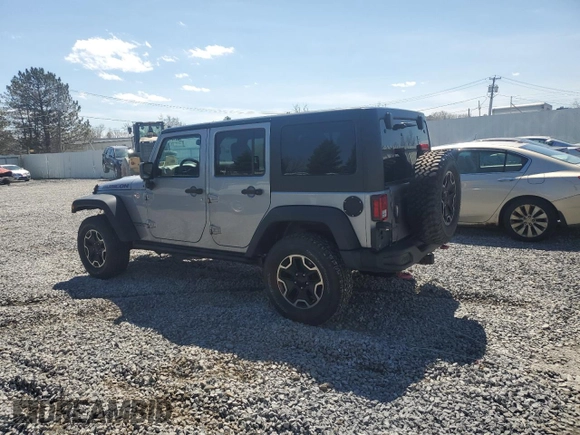 2015 Jeep Wrangler Unlimited Rubicon Hard Rock with VIN 1C4HJWFG2FL686556, listed as a Copart auction lot 54049955 with 126,675 mi miles and Salvage title. Bid and sale history available at DreamBid. Image 2.