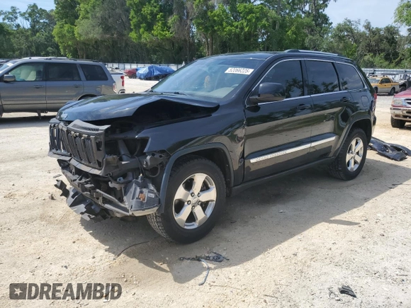 2013 Jeep Grand Cherokee Laredo with VIN 1C4RJEAG2DC519570, listed as a Copart auction lot 52066225 with 129,091 mi miles and Salvage Title. Bid and sale history available at carsss.com. Image 1.