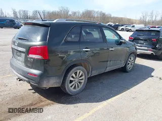 2011 Kia Sorento EX with VIN 5XYKUDA25BG118403, listed as a IAAI auction lot 42017215 with 166,421 mi miles and . Bid and sale history available at carsss.com. Image 4.