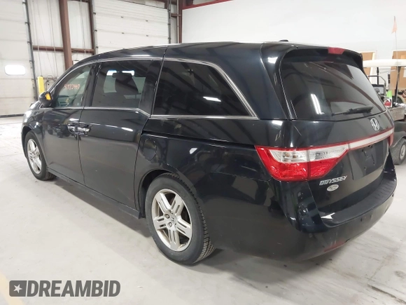 2011 Honda Odyssey Touring with VIN 5FNRL5H9XBB055008, listed as a IAAI auction lot 41973447 with 218,762 mi miles and . Bid and sale history available at DreamBid. Image 3.