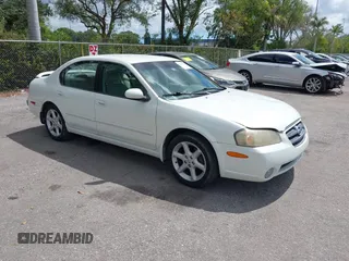 2003 Nissan Maxima SE z VIN JN1DA31DX3T501453, wystawiony jako IAAI lot #42116346 z przebiegiem 127 364 mil mil oraz . Historia ofert i sprzedaży dostępna na DreamBid. Obrazek 1.