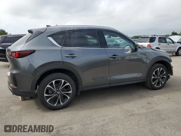 2023 Mazda CX-5 2.5 S Premium Package with VIN JM3KFBDM5P0229694, listed as a Copart auction lot 64811974 with 9,901 mi miles and Non Repairable. Bid and sale history available at carsss.com. Image 3.