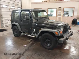 2003 Jeep Wrangler Sport Right Hand Drive with VIN 1J4F449S63P359031, listed as a IAAI auction lot 41495087 with 126,678 mi miles. Bid and sale history available at carsss.com. Image 1.