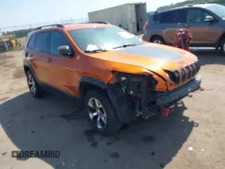 2014 Jeep Cherokee Trailhawk with VIN 1C4PJMBB2EW243573, listed as a IAAI auction lot 42524310 with 124,344 mi miles and . Bid and sale history available at DreamBid. Image 1.