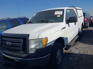 2010 Ford F-150 XL with VIN 1FTEX1E88AKE76184, listed as a IAAI auction lot 41715520 with 157,449 mi miles. Bid and sale history available at carsss.com. Image 2.