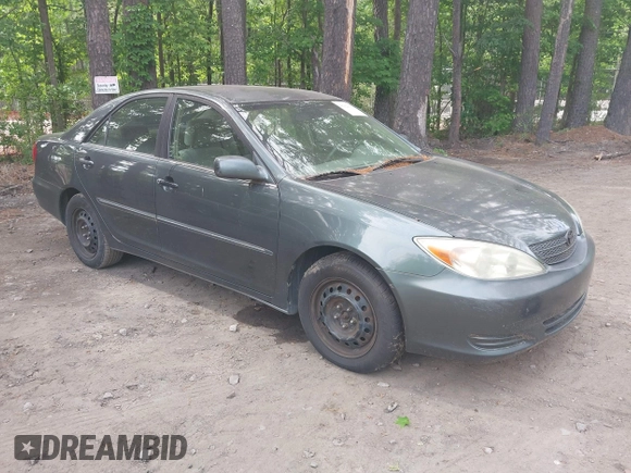 2002 Toyota Camry LE z VIN 4T1BE32K12U619689, wystawiony jako IAAI lot #42222078 z przebiegiem 216 591 mil mil oraz . Historia ofert i sprzedaży dostępna na DreamBid. Obrazek 1.
