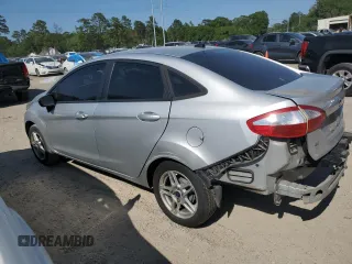 2019 Ford Fiesta SE z VIN 3FADP4BJXKM123806, wystawiony jako Copart lot #53184825 z przebiegiem 141 759 mil mil oraz Szkoda całkowita • Salvage title. Historia ofert i sprzedaży dostępna na DreamBid. Obrazek 2.