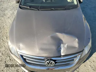 2010 Volkswagen CC Sport with VIN WVWMN7AN3AE541988, listed as a Copart auction lot 77670794 with 100,277 mi miles and Salvage Title. Bid and sale history available at DreamBid. Image 12.
