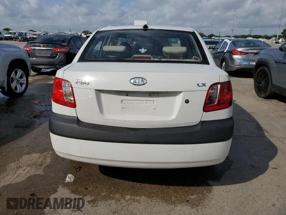 2009 Kia Rio LX with VIN KNADE223X96439445, listed as a Copart auction lot 54619335 with 102,120 mi miles and Salvage Title. Bid and sale history available at DreamBid. Image 6.