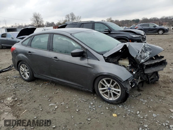 2018 Ford Focus SE with VIN 1FADP3F29JL206477, listed as a Copart auction lot 50410345 with 70,955 mi miles and Salvage Title. Bid and sale history available at DreamBid. Image 4.