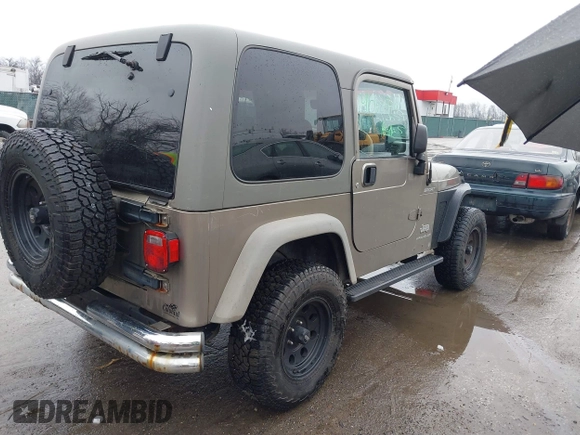 2006 Jeep Wrangler Sport Right Hand Drive with VIN 1J4F449S06P725862, listed as a IAAI auction lot 41562989 with 121,997 mi miles. Bid and sale history available at carsss.com. Image 4.