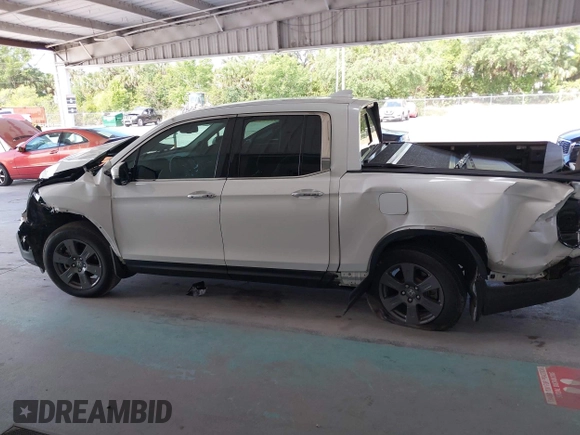 2020 Honda Ridgeline RTL-E with VIN 5FPYK3F71LB005028, listed as a IAAI auction lot 42167883 with 81,882 mi miles and . Bid and sale history available at DreamBid. Image 14.