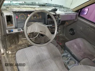 1987 Nissan Hardbody E z VIN JN6ND11S3HW057122, wystawiony jako Copart lot #73303004 z przebiegiem 233 309 mil mil oraz Szkody całkowita. Historia ofert i sprzedaży dostępna na DreamBid. Obrazek 8.