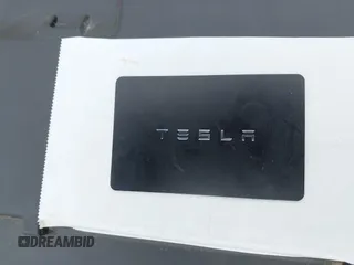 2019 Tesla Model 3 Mid Range with VIN 5YJ3E1EA6KF415656, listed as a IAAI auction lot 42140763 with 71,408 mi miles and . Bid and sale history available at carsss.com. Image 11.