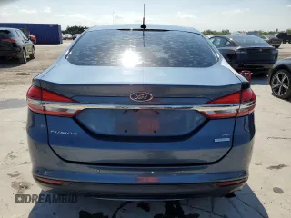2018 Ford Fusion SE z VIN 3FA6P0HD7JR180095, wystawiony jako Copart lot #55980745 z przebiegiem 76 994 mil mil oraz Czysty tytuł • Clean title. Historia ofert i sprzedaży dostępna na DreamBid. Obrazek 6.