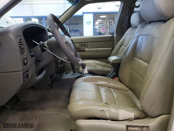 2000 Infiniti QX4 with VIN JNRAR07Y3YW084474, listed as a Copart auction lot 87089994 with 237974 miles and Salvage Title. Bid and sale history available at carsss.com. Image 7.