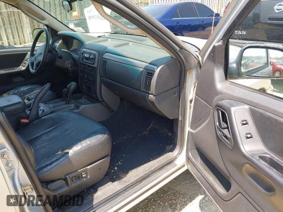 2004 Jeep Grand Cherokee Laredo with VIN 1J4GW48S94C369643, listed as a IAAI auction lot 42693998 with 225,033 mi miles and . Bid and sale history available at DreamBid. Image 5.
