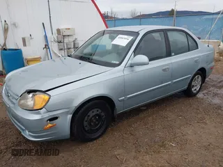 2003 Hyundai Accent GL z VIN KMHCG45C43U465523, wystawiony jako IAAI lot #40883056 z przebiegiem 95 770 mil mil oraz . Historia ofert i sprzedaży dostępna na DreamBid. Obrazek 17.