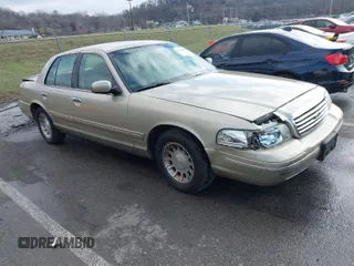 1999 Ford Crown Victoria LX z VIN 2FAFP74W0XX179512, wystawiony jako IAAI lot #41124866 z przebiegiem 101 282 mil mil oraz . Historia ofert i sprzedaży dostępna na DreamBid. Obrazek 1.