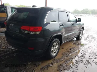 2014 Jeep Grand Cherokee Laredo with VIN 1C4RJEAG6EC206748, listed as a IAAI auction lot 42244421 with 198,217 mi miles and . Bid and sale history available at DreamBid. Image 4.