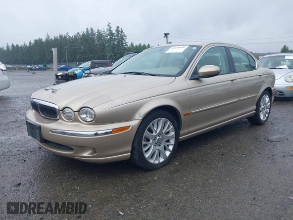 2003 Jaguar X-Type 2.5L Manual z VIN SAJEA51D53XC94089, wystawiony jako IAAI lot #42370566 z przebiegiem 81 687 mil mil oraz . Historia ofert i sprzedaży dostępna na DreamBid. Obrazek 2.